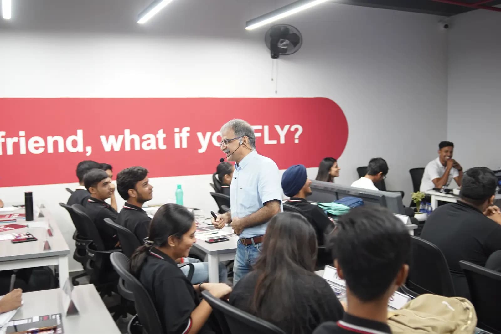 An industry practitioner teaching NEXIS students in class