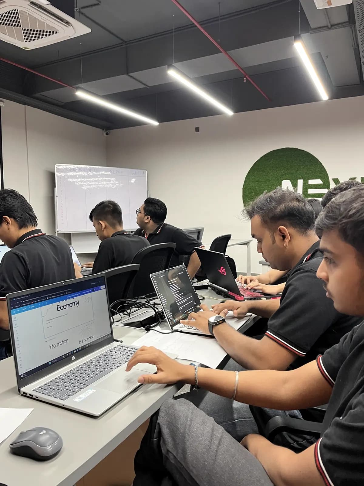 Students working on digital projects during a laptop workshop